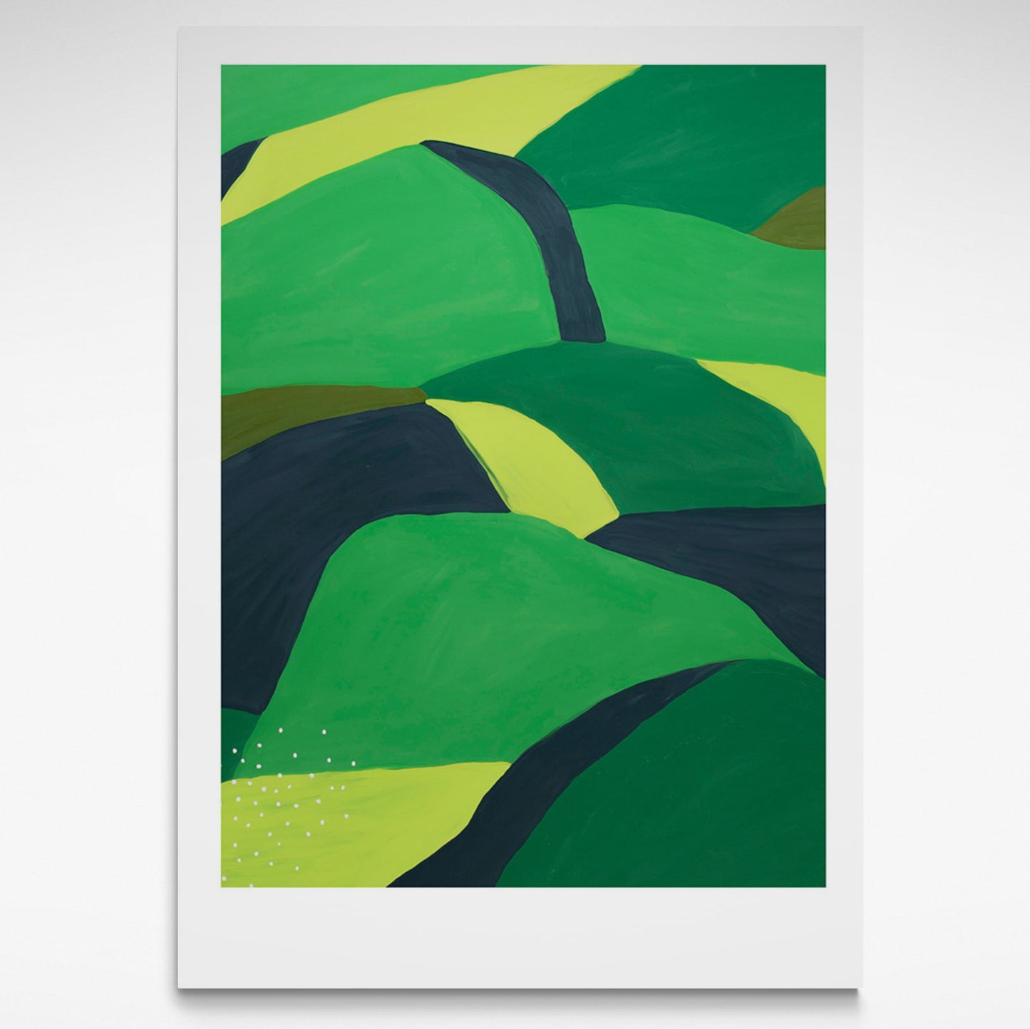 Landscape of greens and black rolling hills.