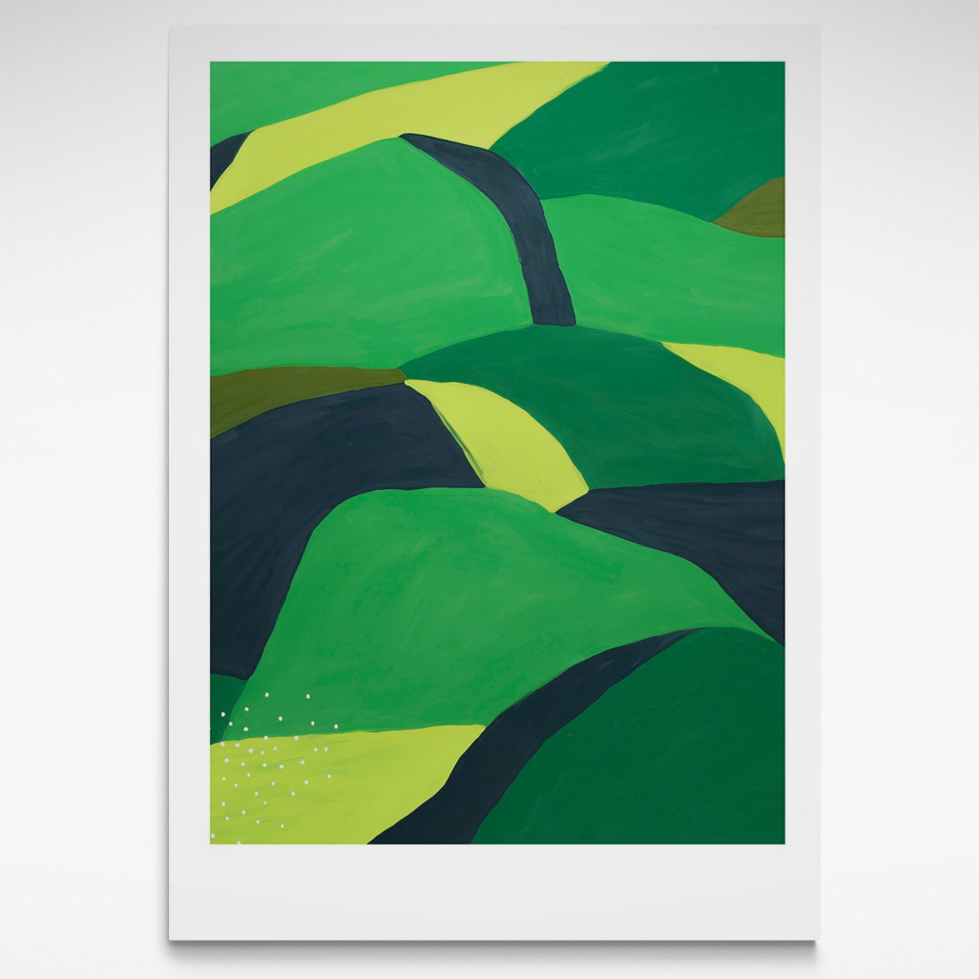 Landscape of greens and black rolling hills.
