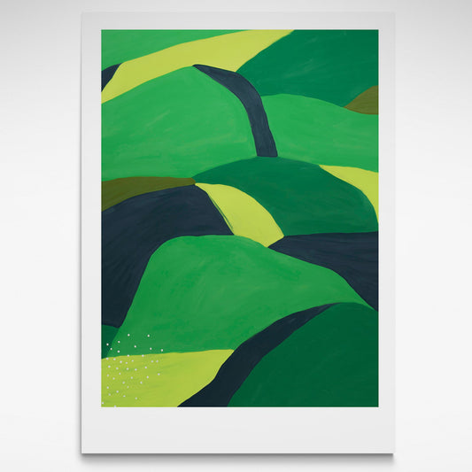 Landscape of greens and black rolling hills.