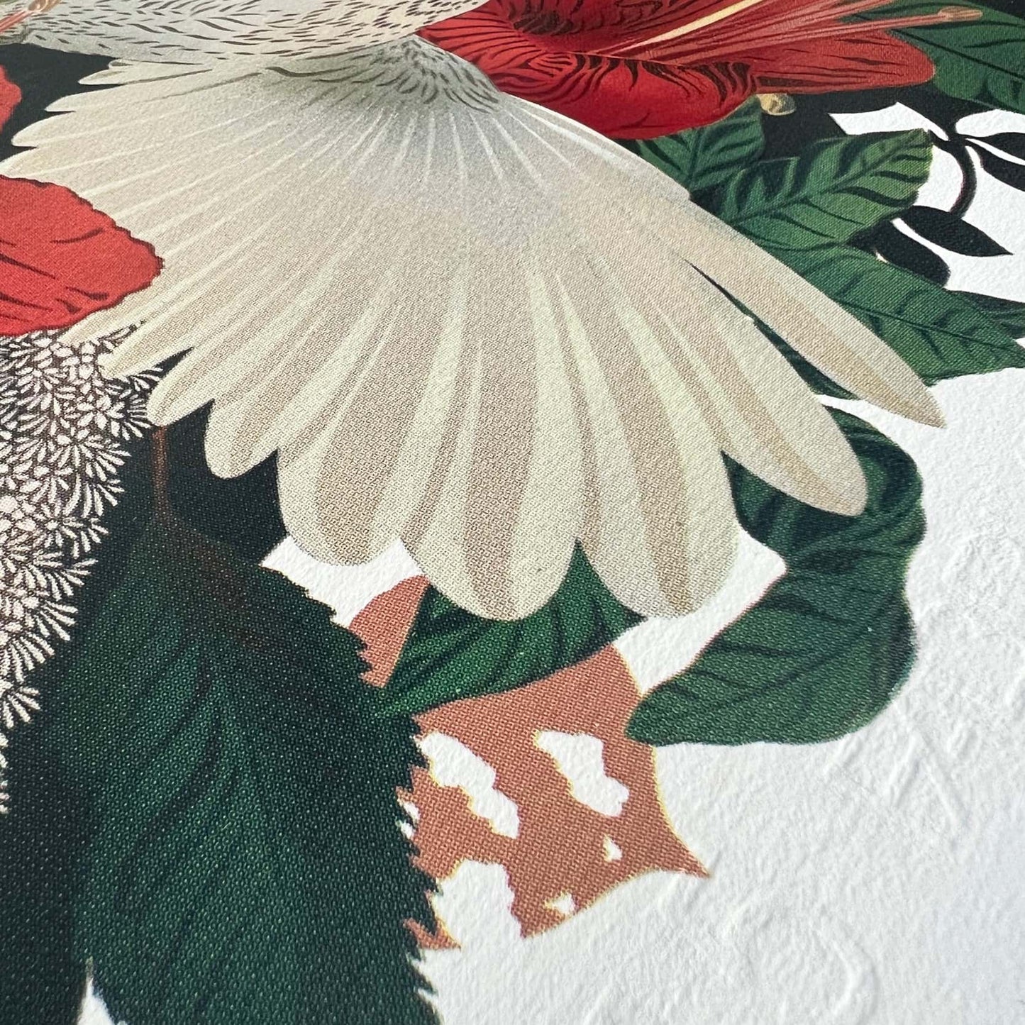 Close up of a Flox silkscreen showing red hibiscus flower, Fantail wing and edge of paper