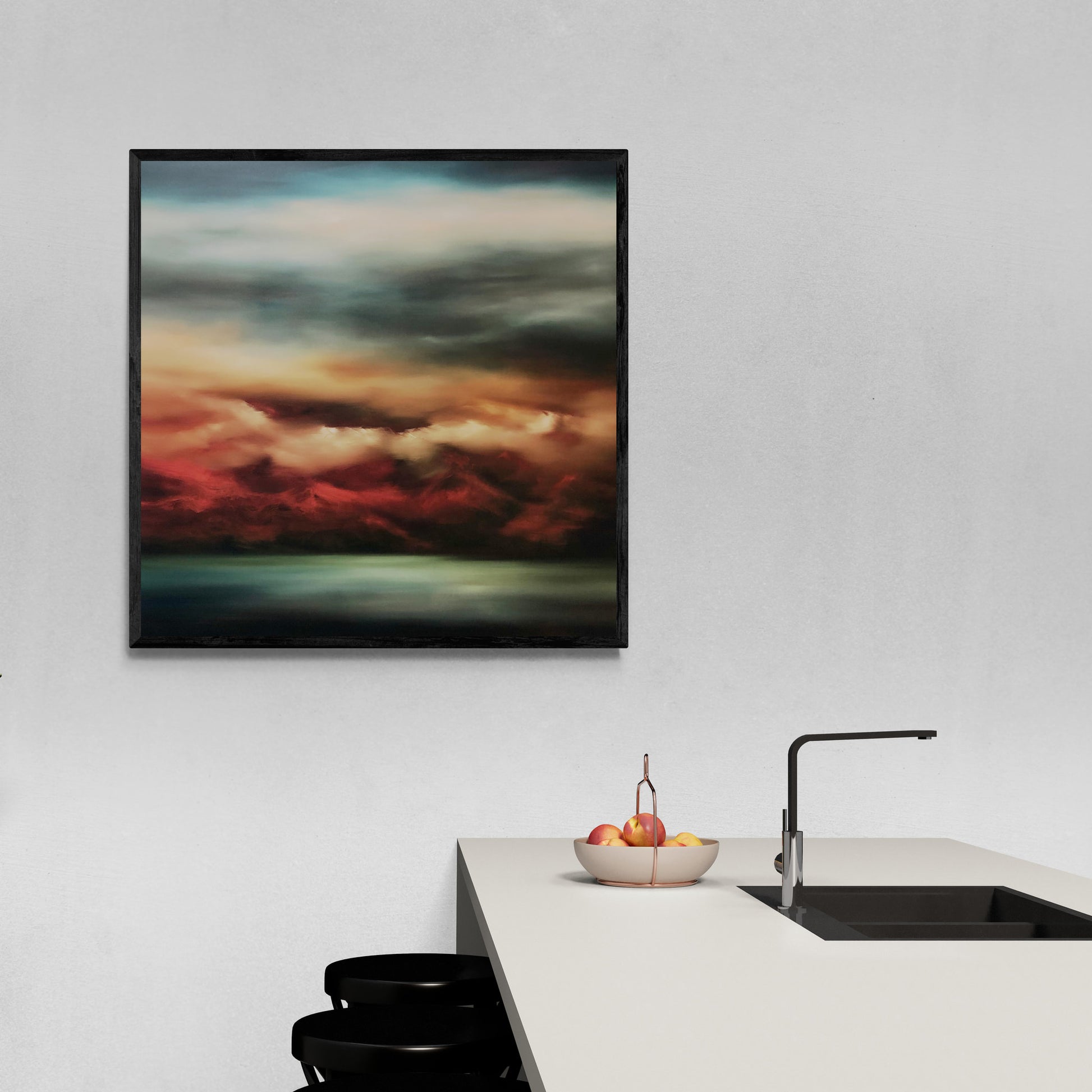 Framed and hanging print of view across bay to a mountain range at Sunset with rich reds, blues and greens.