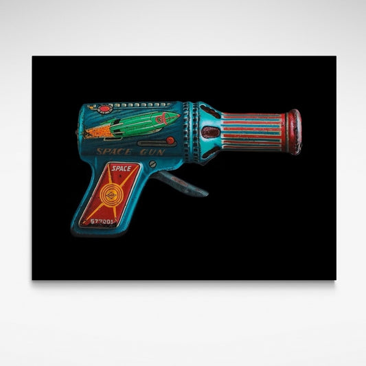 Old school image of colourful lead raygun toy