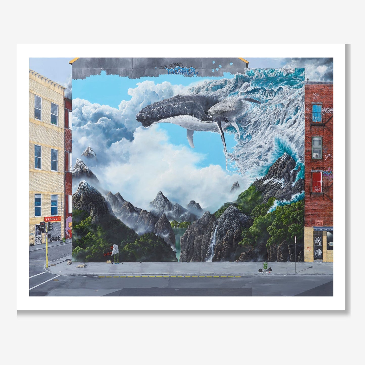 Mural of a whale emerging from a mountainous landscape on a city street.