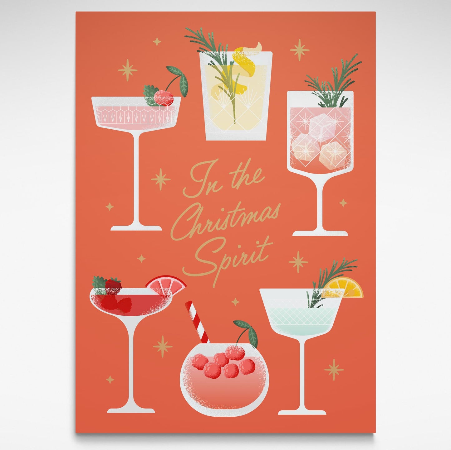 Art print with illustrations of cocktails and 'In the Christmas Spirit' text on a a soft orange background.