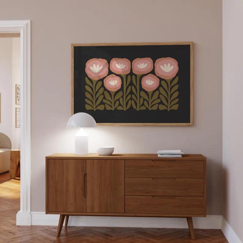 The Green and Black Floral Print by Solstice Studio Prints is hanging above a sideboard