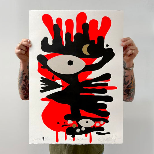 Abstract painting of red and black with  two eyes and gold moon and dot accents