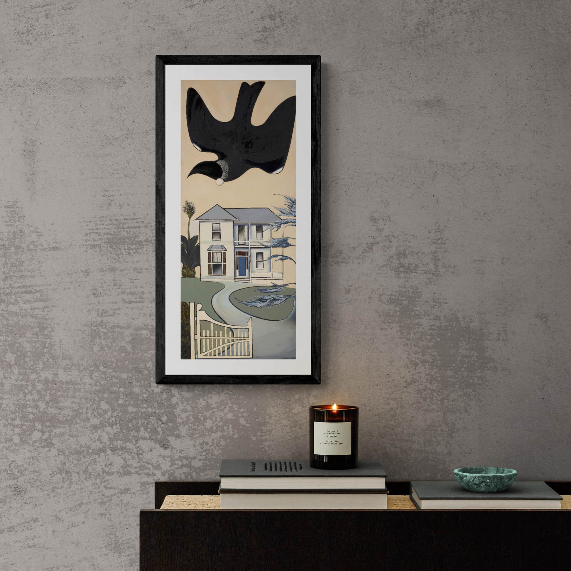 Print of Don Binney’s "Colonial Garden Bird" showing a New Zealand tūī in a garden, hanging on wall above sideboard.