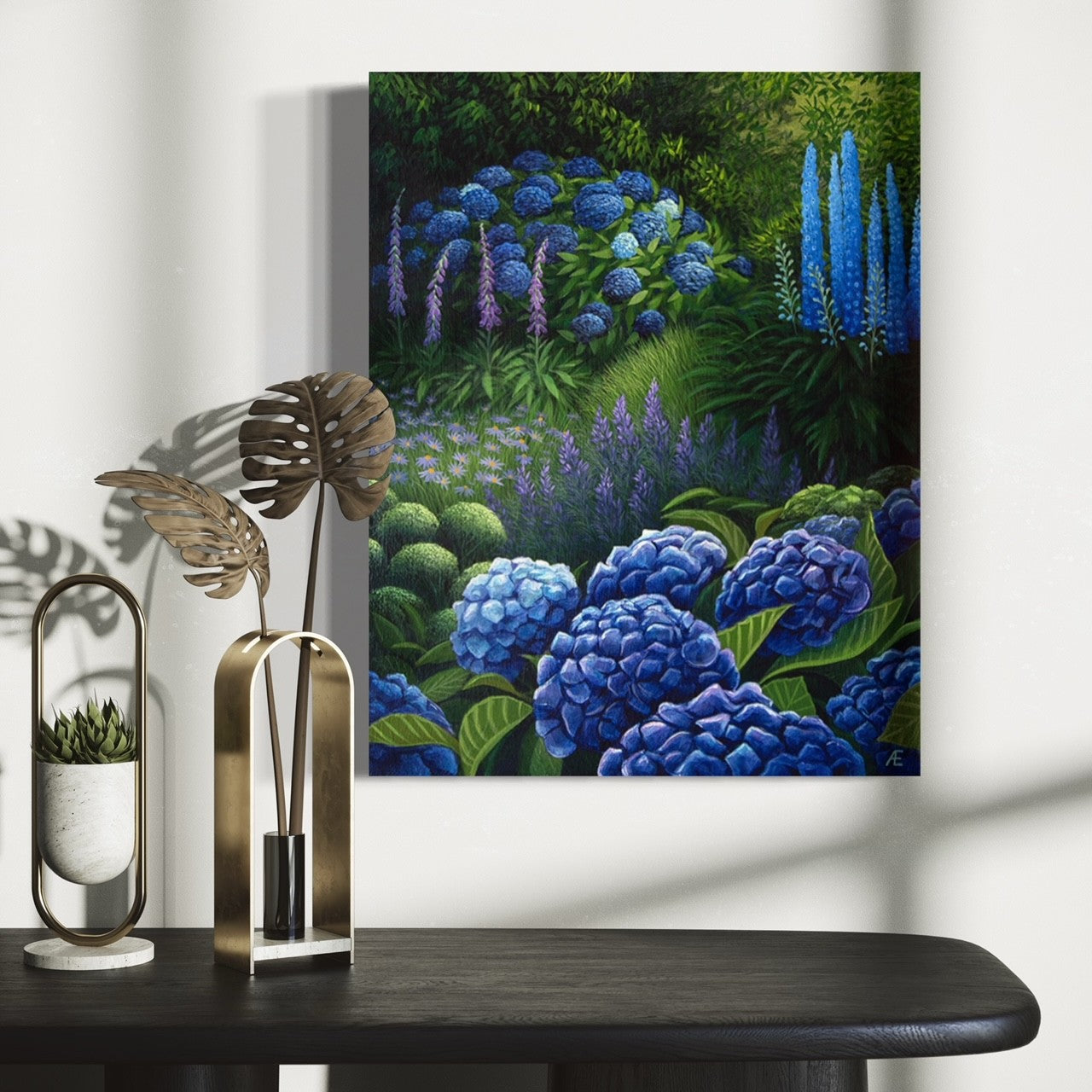 Stretched canvas of beautiful garden scene thats washed in light hanging above a table.