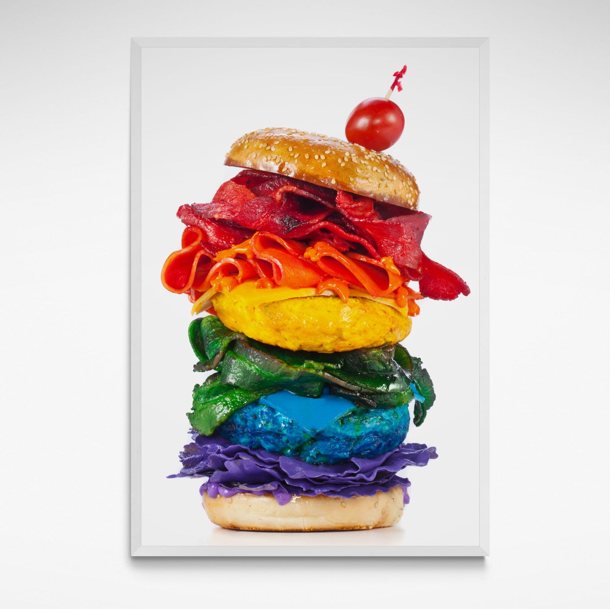 A vibrant framed photographic print of a rainbow-coloured burger from Henry Hargreaves' *Food of the Rainbow* series, showcasing bold colours and playful creativity.