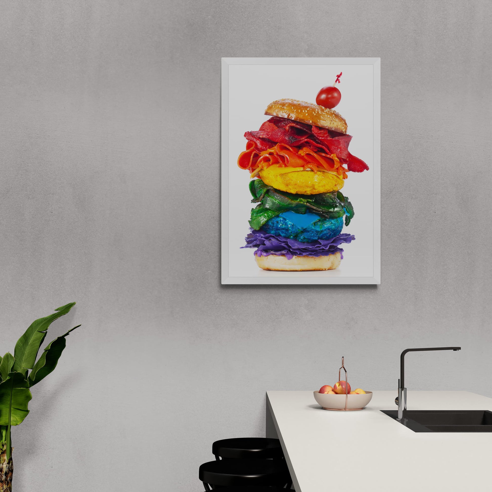 A framed photographic print of a rainbow-coloured burger from Henry Hargreaves' *Food of the Rainbow* series hanging on wall in kitchen,