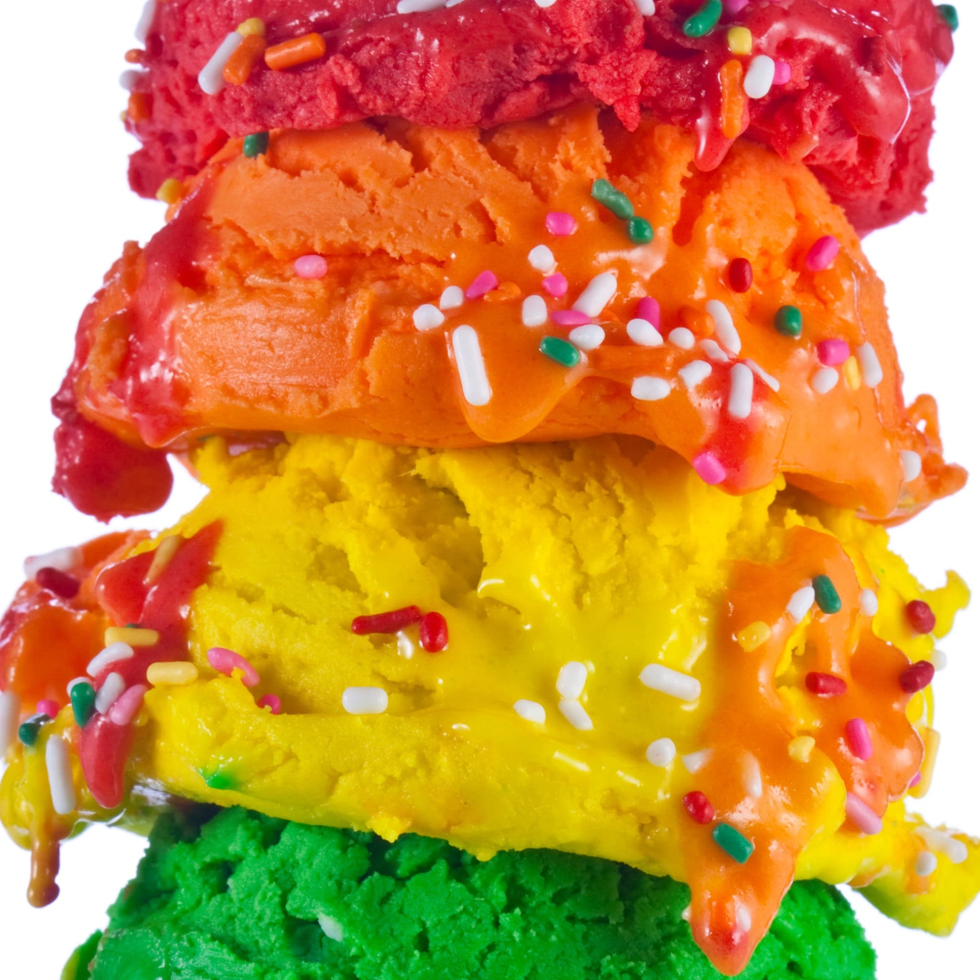 Close-up of a rainbow-coloured ice cream cone photographic print by Henry Hargreaves.