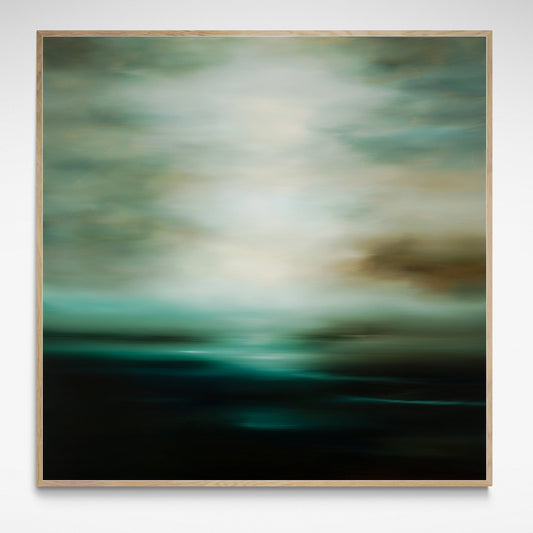 Framed moody landscape of greens and white cloudy coastal horizon.