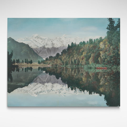 Print of lake with mountains, sky and bush mirrored in it.
