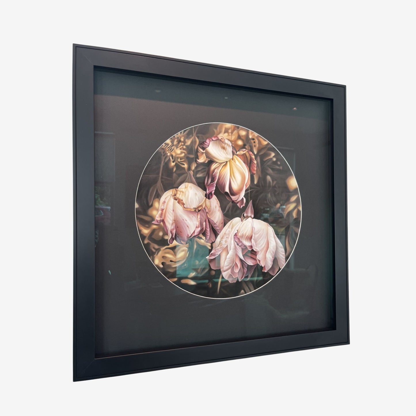 Framed artwork of decaying pink flowers on a white background