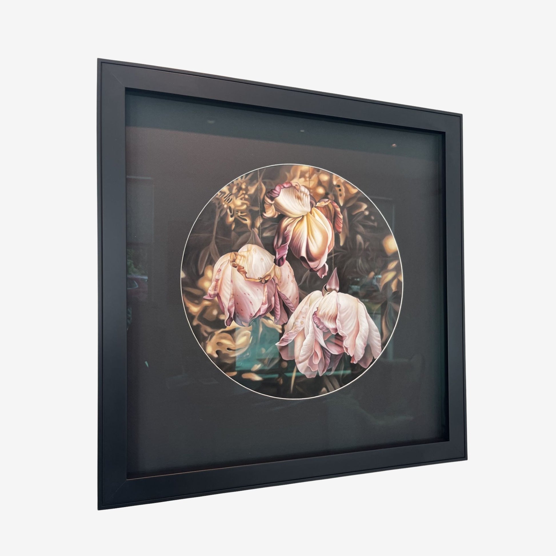 Framed artwork of decaying pink flowers on a white background