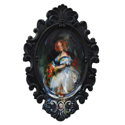 Decorative oval frame with a painting by Anita DeSoto of a woman holding flowers on a dark background