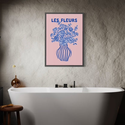 Framed artwork with floral design and 'LES FLEURS' text above a bathtub.