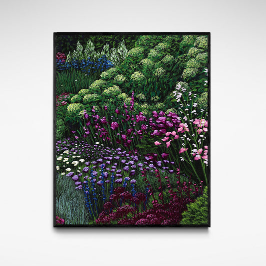 Framed print of a garden scene with blue, pink and purple flowers.