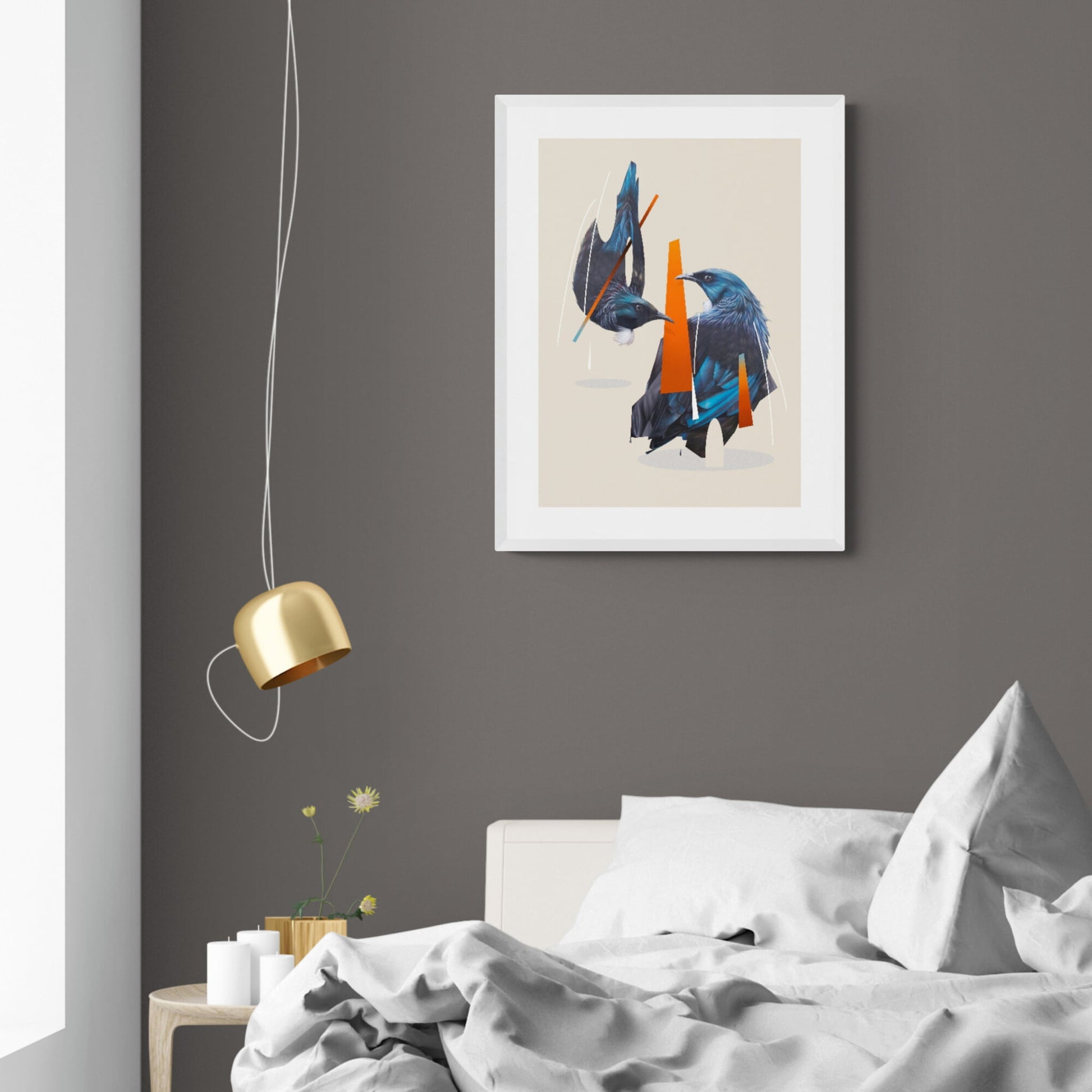 Two blue Tui hanging above a messy bed