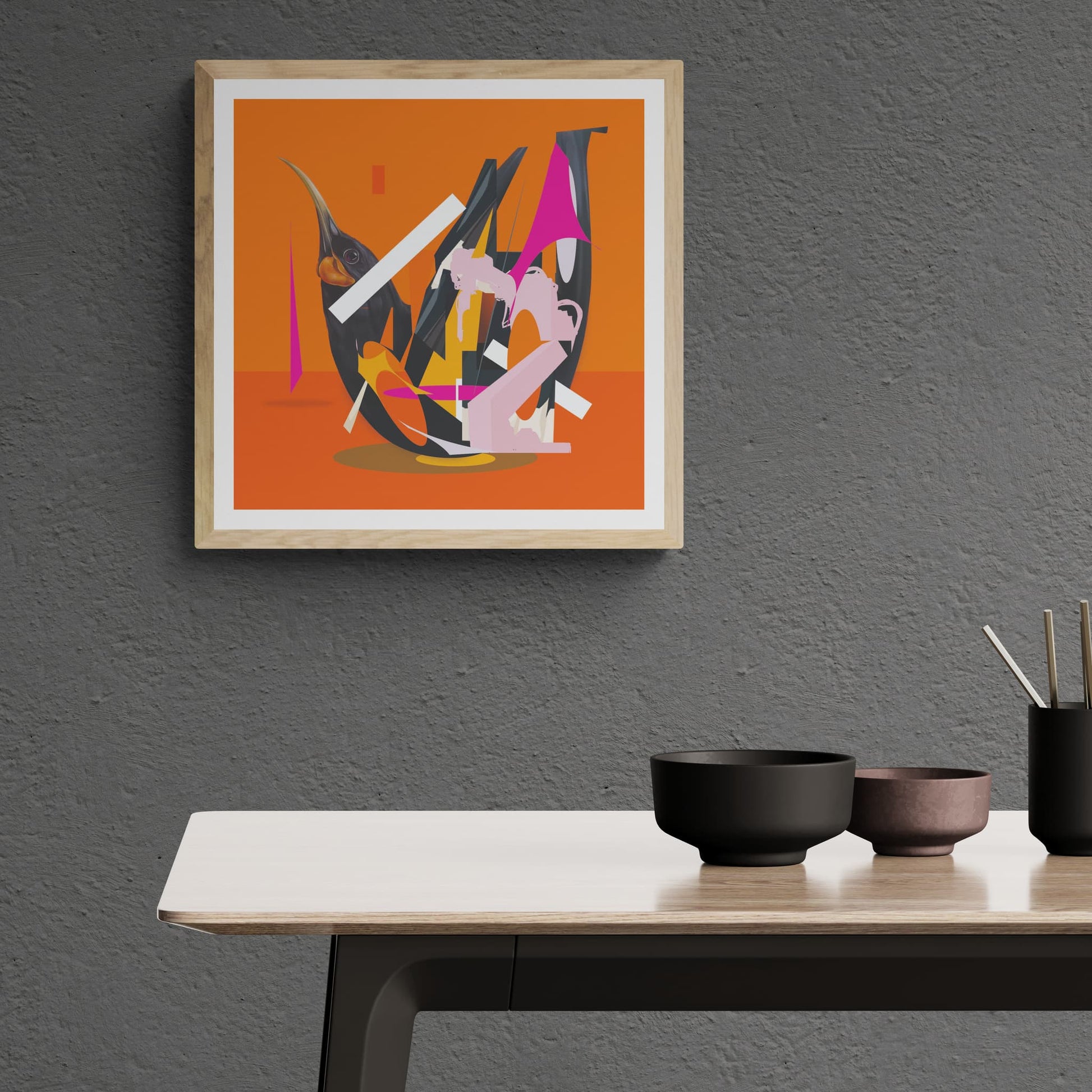 Colourful red, orange & pink abstract print of  a Huia on a bright orange back ground, hanging on wall above a table.