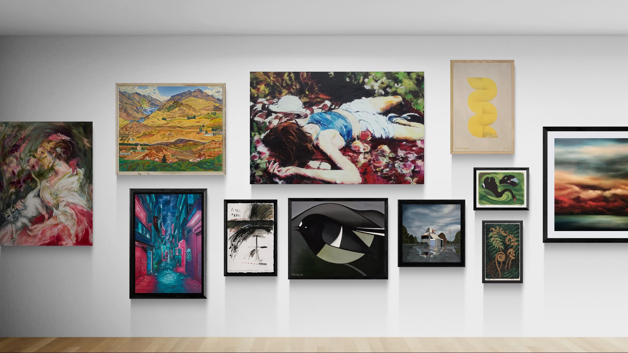 A gallery wall display featuring multiple framed art prints and paintings in various colors and styles, mounted on a white wall above a light wood floor.