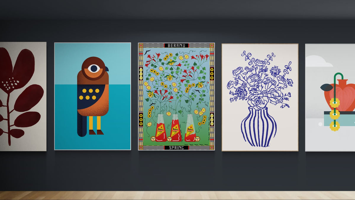 Five framed abstract art prints displayed side-by-side on a dark gray gallery wall above a light wood floor. The prints are by olstice Studio Prints, Beth Xia and Francesca Melis