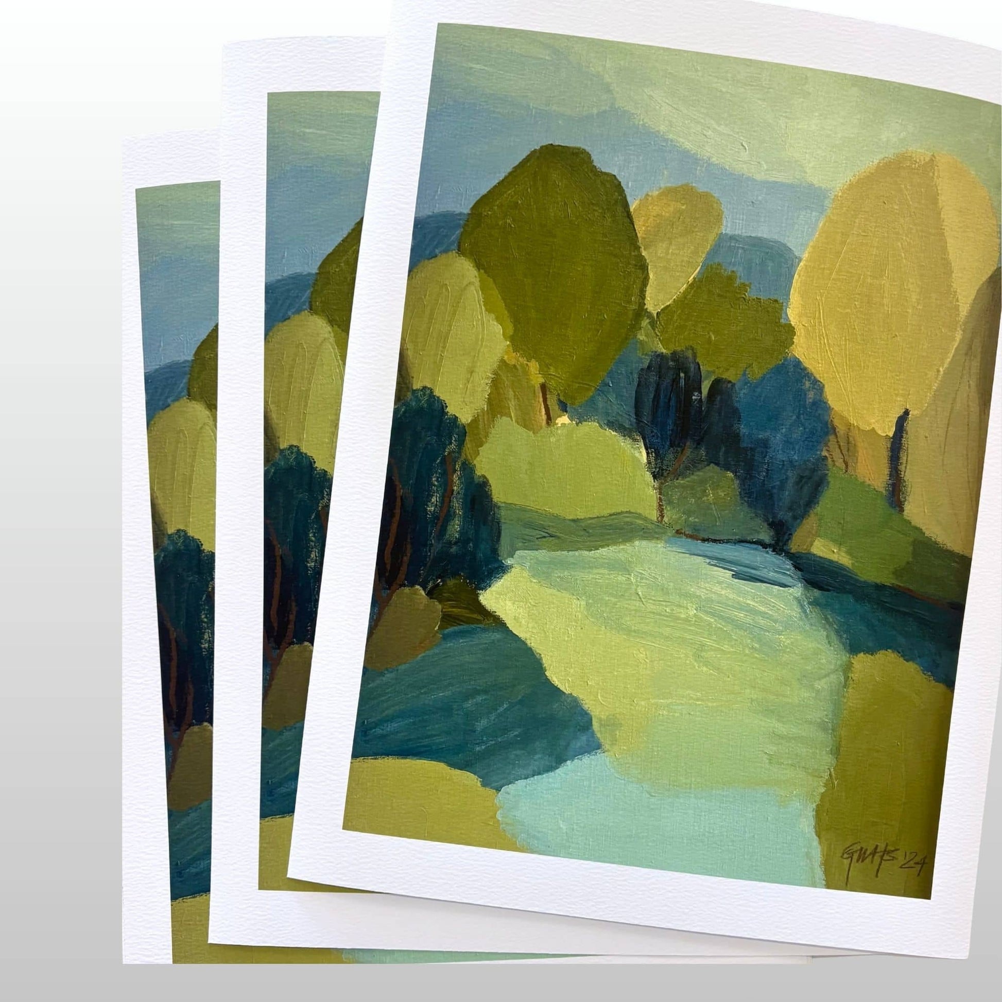 Landscape prints of trees and a river on a white background in blue, yellow and green colours.