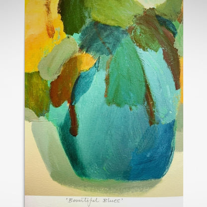 Abstract print of blue vase with bright, yellow, orange, brown, green and blue flowers.