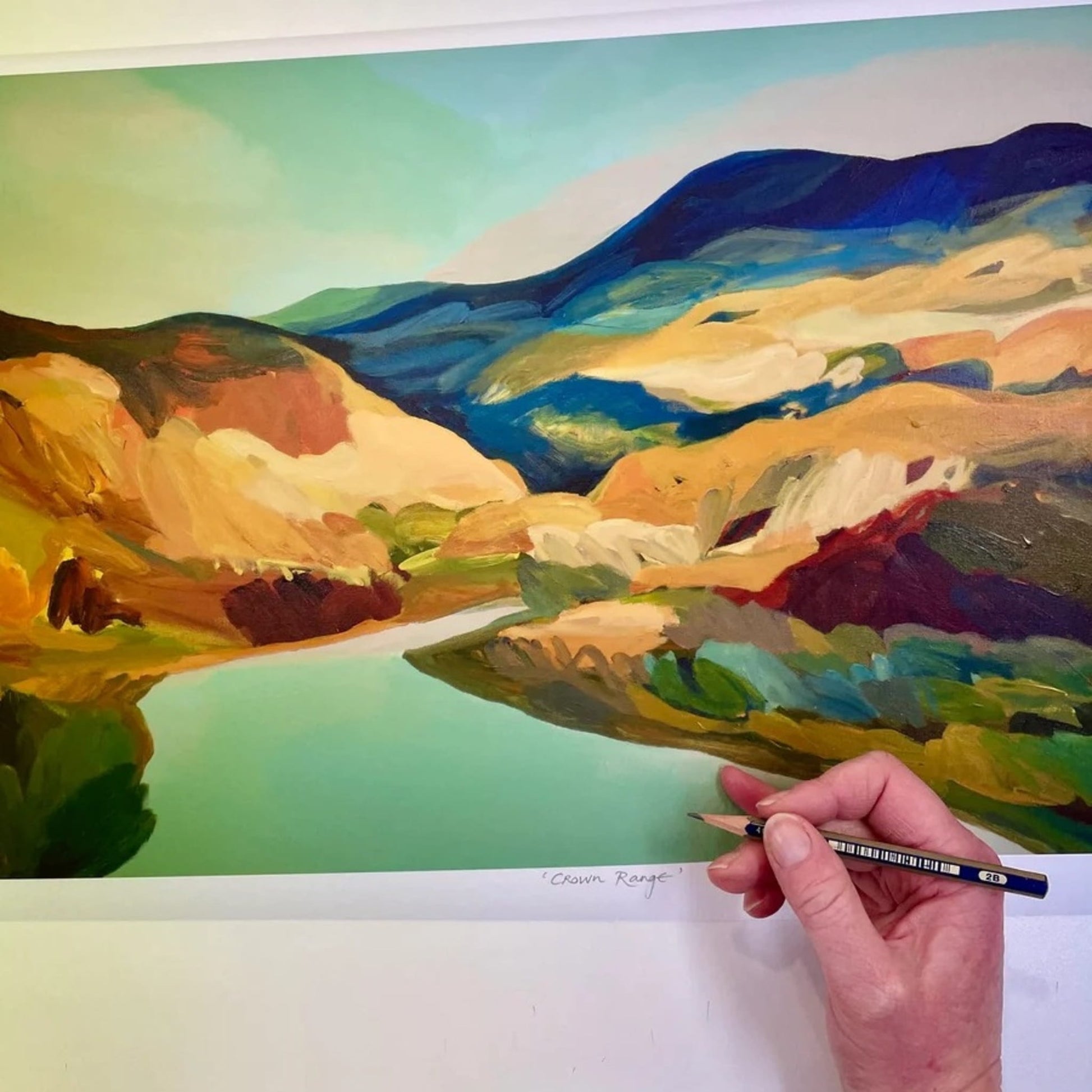 Colourful print of Crown Range with the bright blue Cardrona River in the foreground.