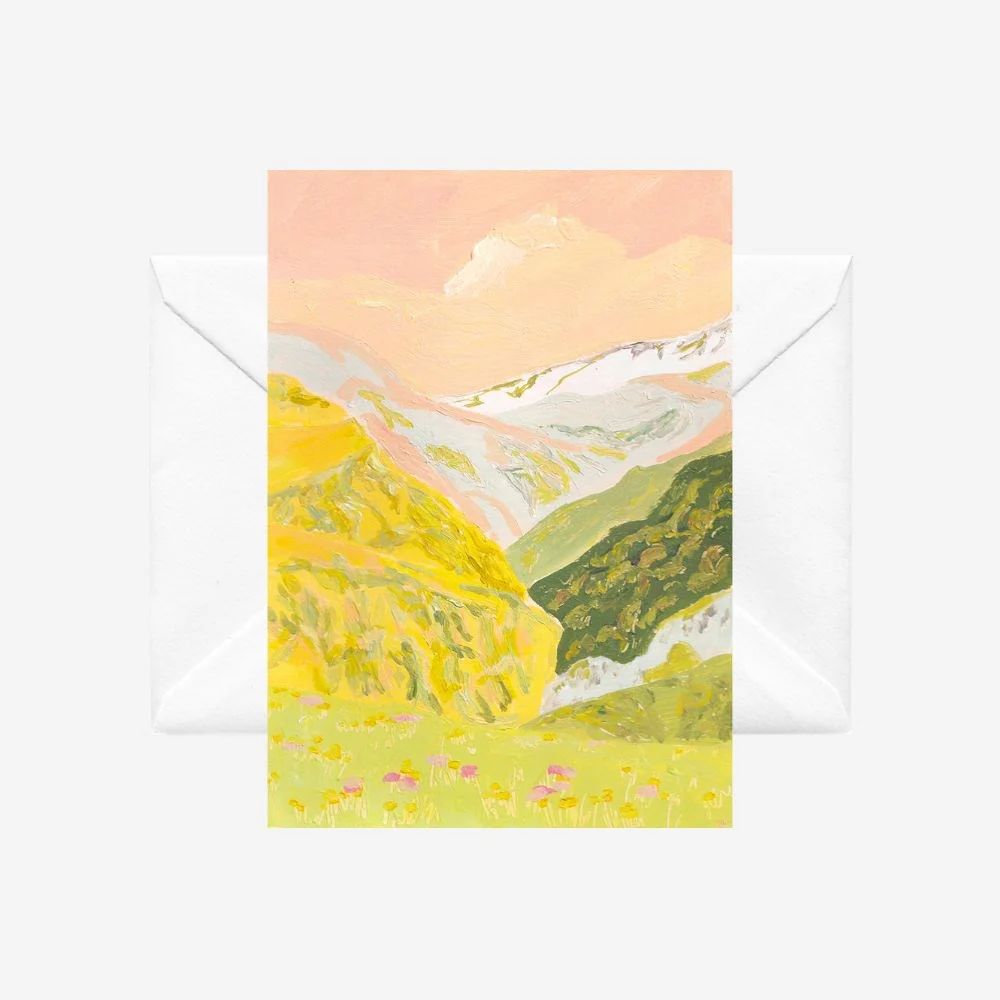 Pastel coloured landscape with sky and mountains in the background