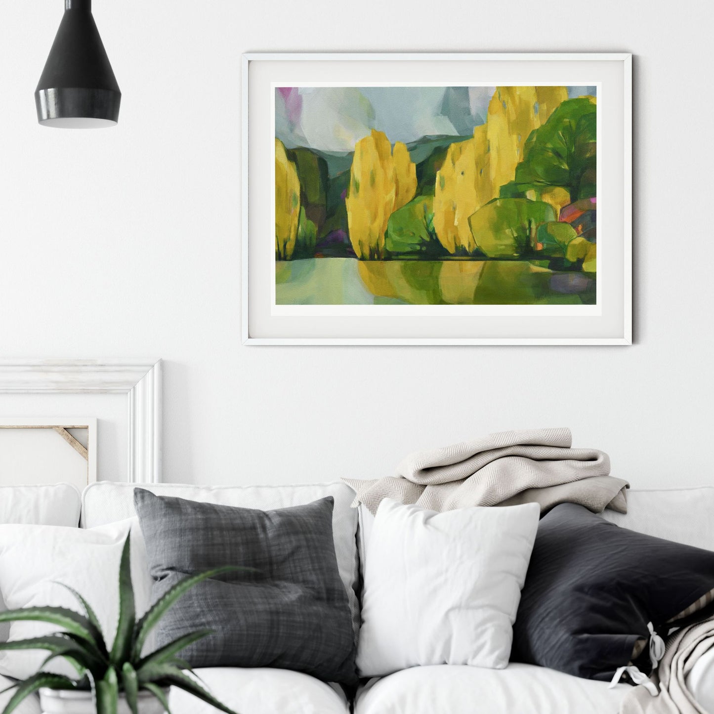 Staged Limited edition art print titled "All the Other Trees" by Holly Roach, featuring autumnal trees inspired by Central Otago, in warm, earthy tones along a riverside.