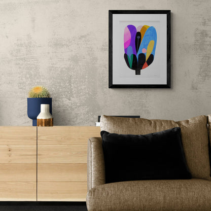 Vivid and colourful abstract azure bloom print, framed and hanging on wall.