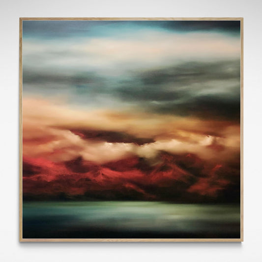 Print of view across bay to a mountain range at Sunset with rich reds, blues and greens.