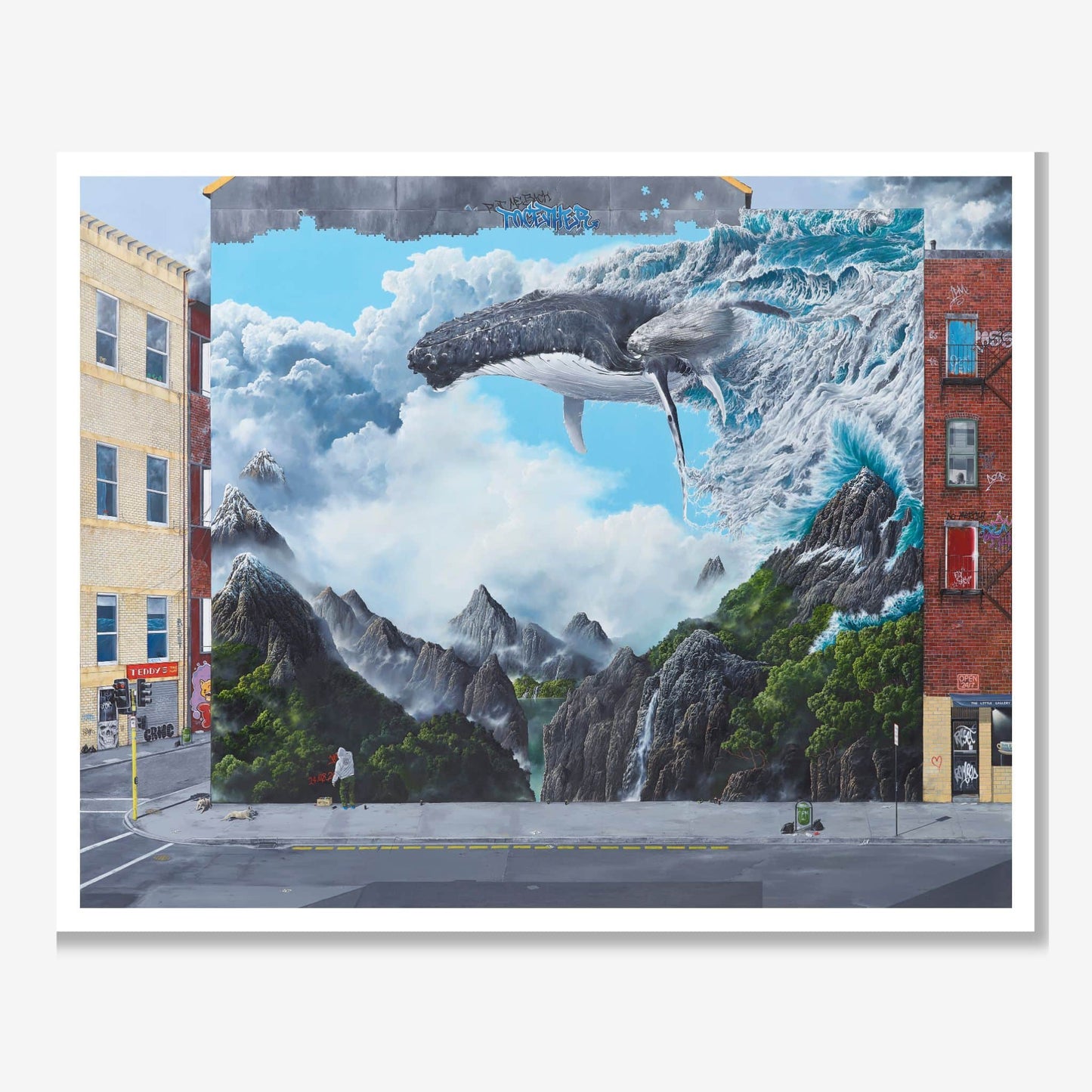 Mural of a whale emerging from a mountainous landscape on a city street.