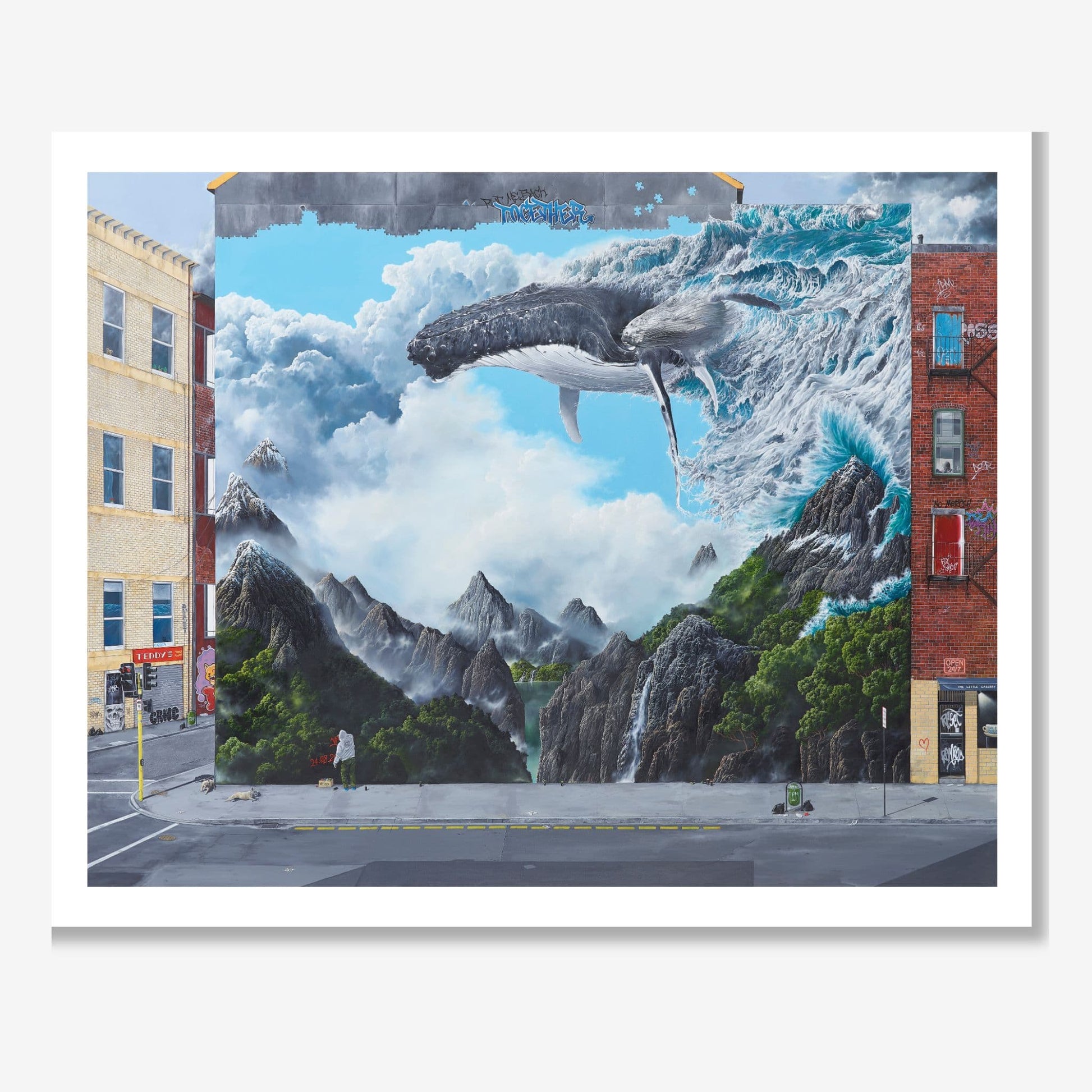 Mural of a whale emerging from a mountainous landscape on a city street.