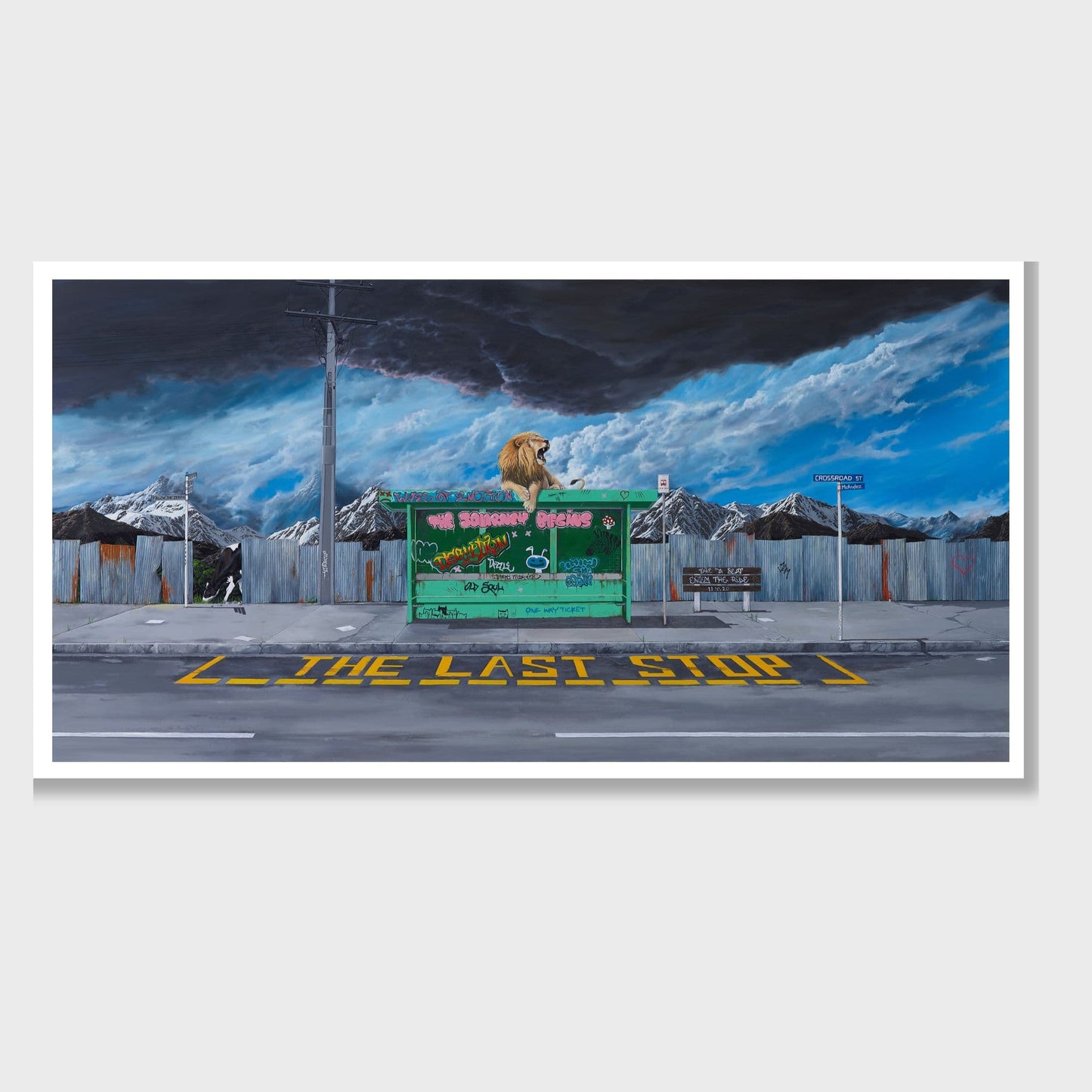 Print of a lion on a bus stop with mountains and black clouds in the background.