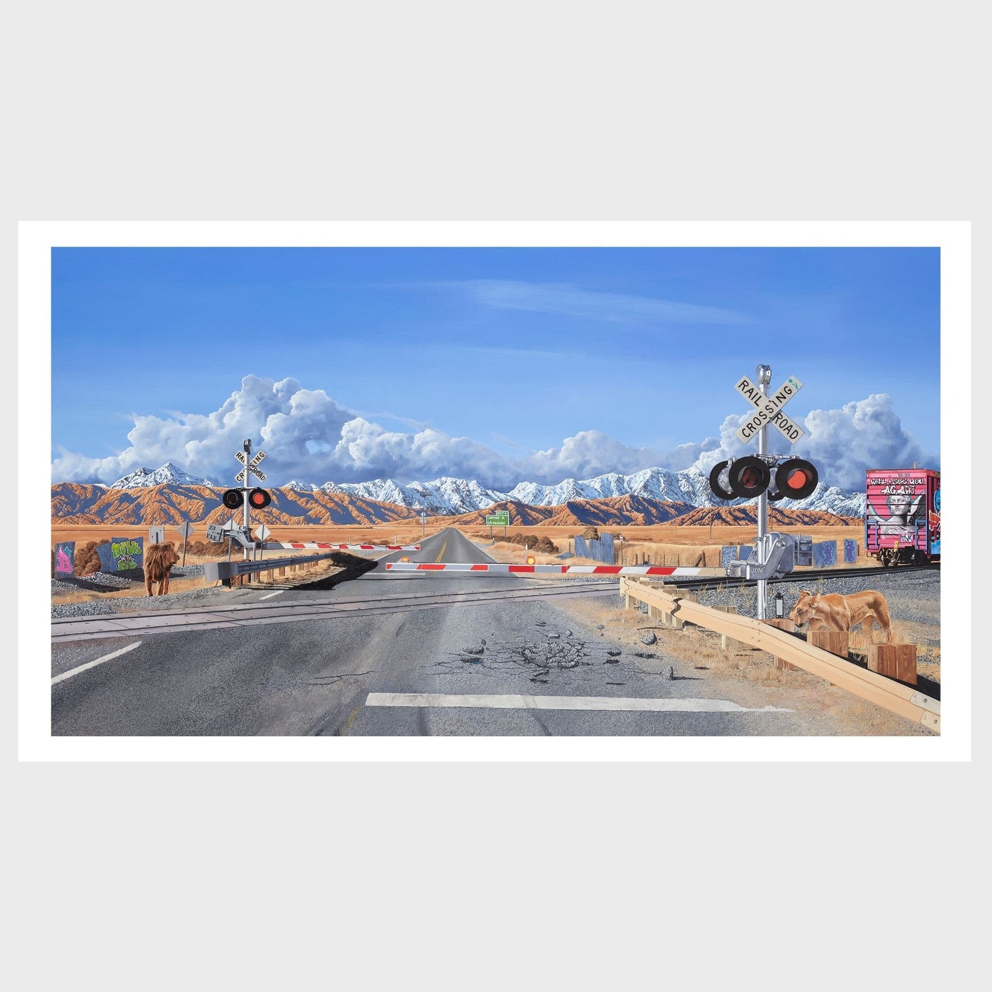 Desert road with a railway crossing, lions and mountains in the background