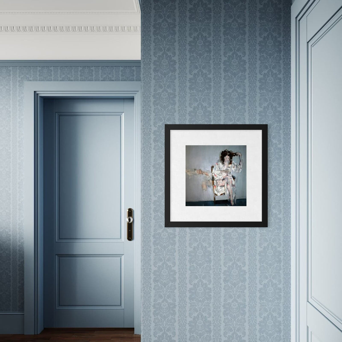 A framed art print, Justine Turnbull's Still Life With Magnolia limited edition print featuring a seated woman holding a coffee cup.