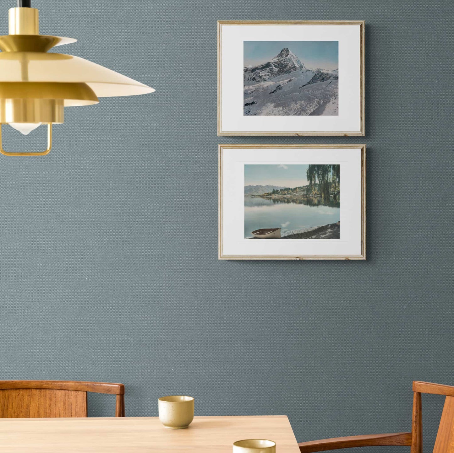 Two framed prints hanging on wall, Lake Wanaka in 1954 and  a snow covered Mt Aspiring.