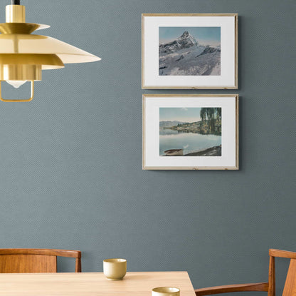 Two framed prints hanging on wall, Lake Wanaka in 1954 and  a snow covered Mt Aspiring.