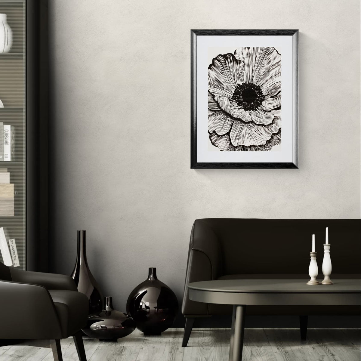 A framed Solstice Studio black and white flower print featuring a large detailed flower with expressive black lines on a cream background hanging above a brown couch.