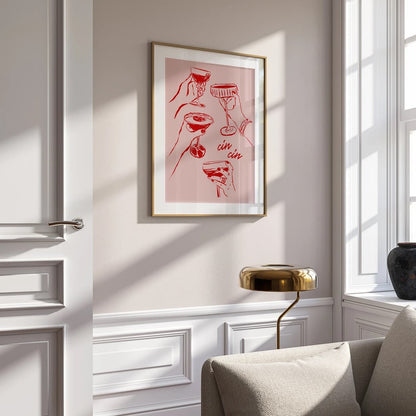 Framed and hanging vibrant pink and red poster by Solstice Studio Prints featuring the playful "Cin Cin Cheers" design.