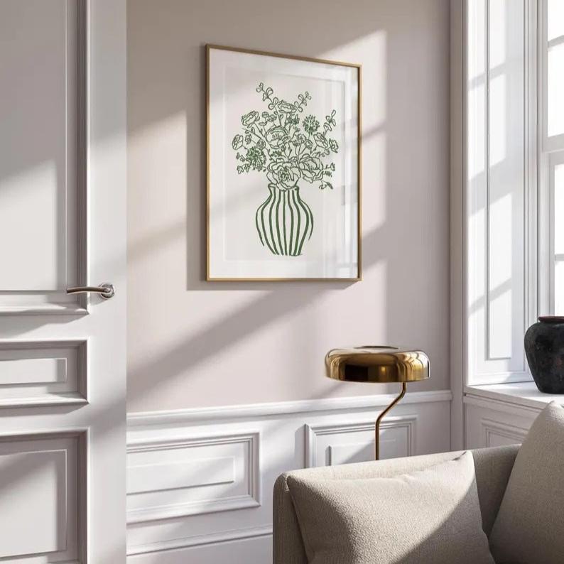 The minimalist green floral poster by Solstice Studio features a retro-striped vase with hand-drawn flowers, perfect for modern living room decor or adding a trendy, artistic touch.