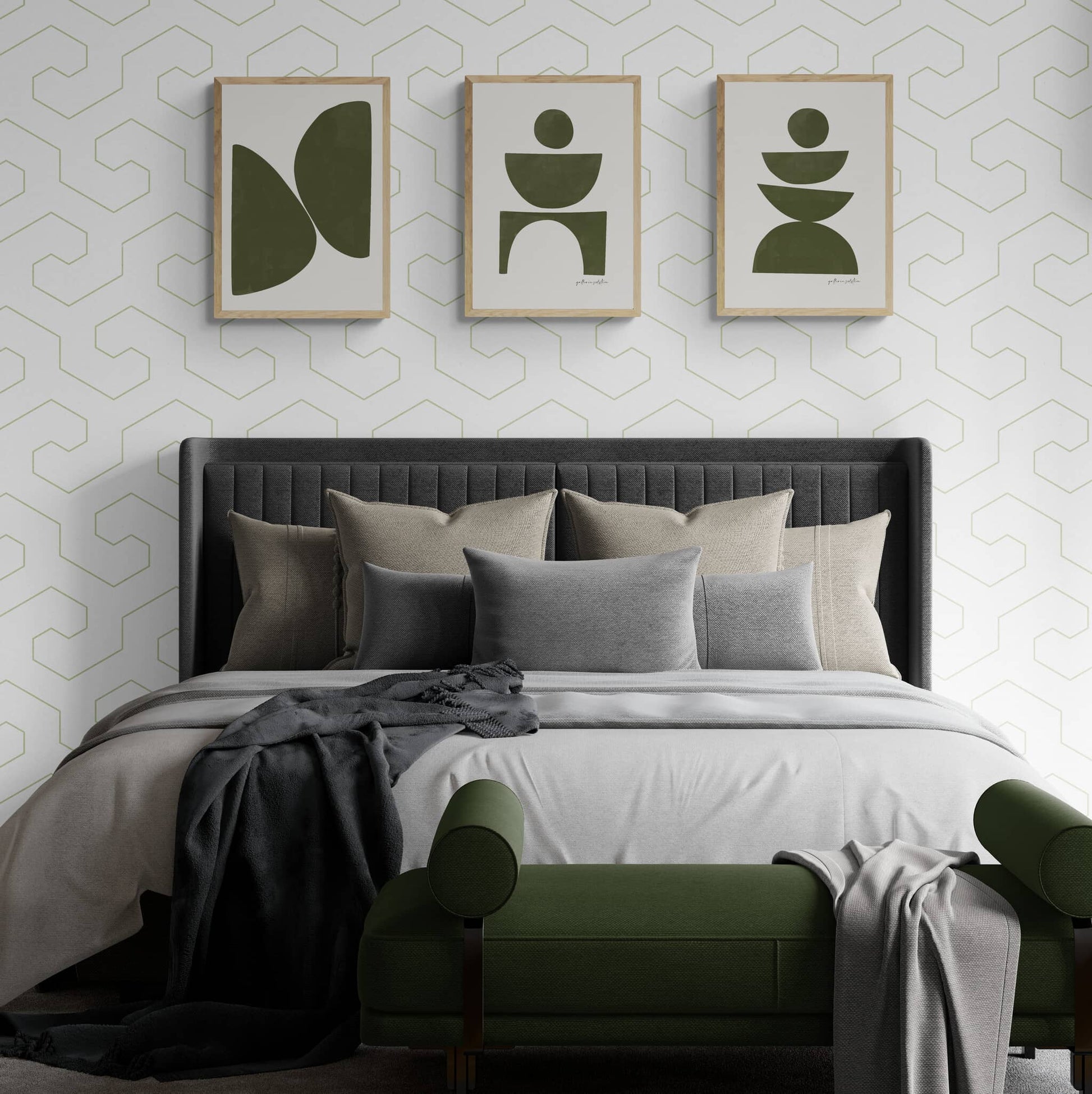 Three olive green mid-century style prints hanging on wall above a bed.