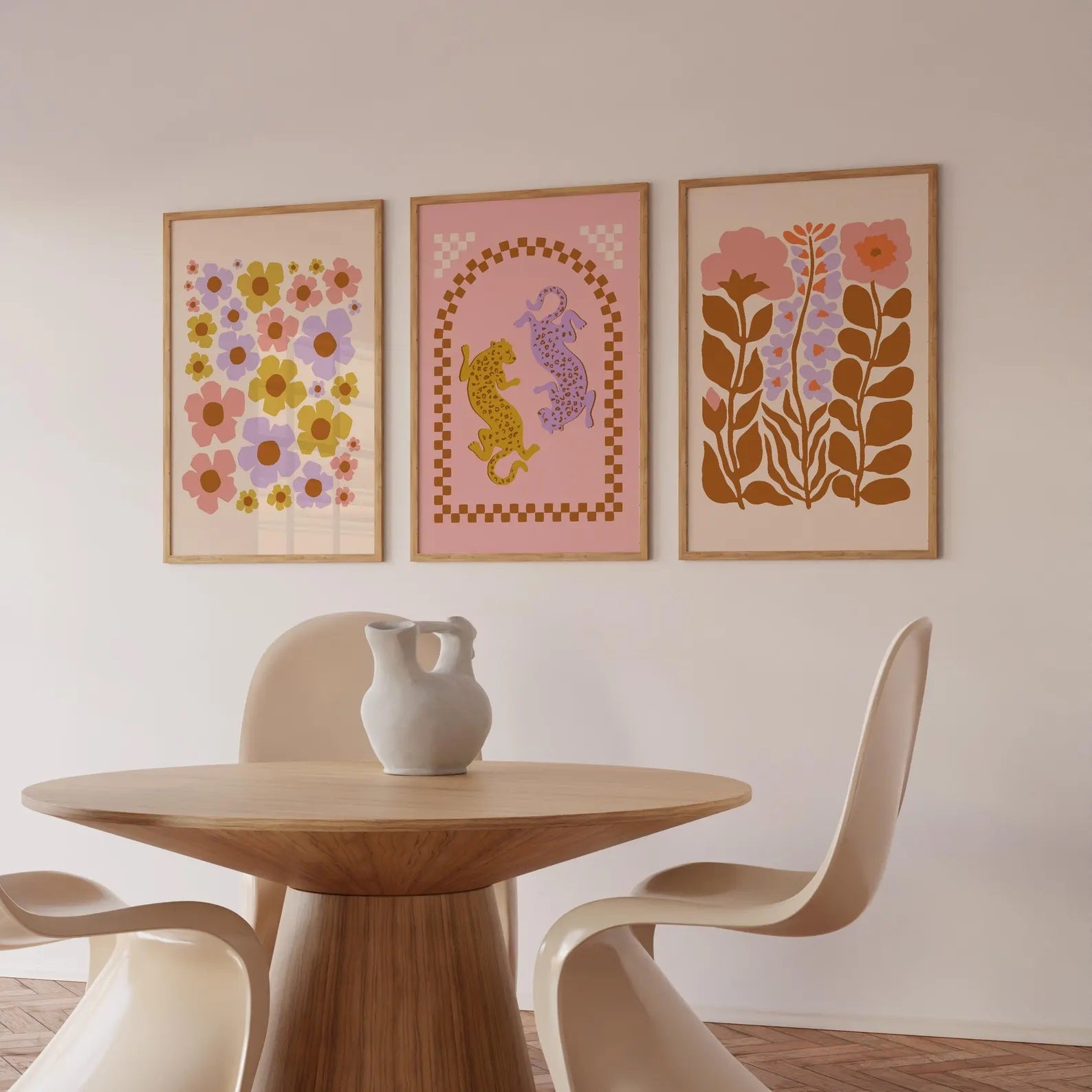 Three Solstice Studio prints framed and on neutral coloured wall