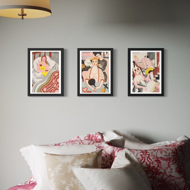 Three prints in boudoir style by Eileen Mayo hanging above a bed