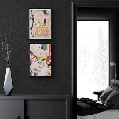 Two colourful prints hanging on a black wall