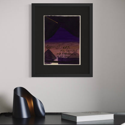 Ralph Hotere framed print on a wall above a desk and book in the foreground