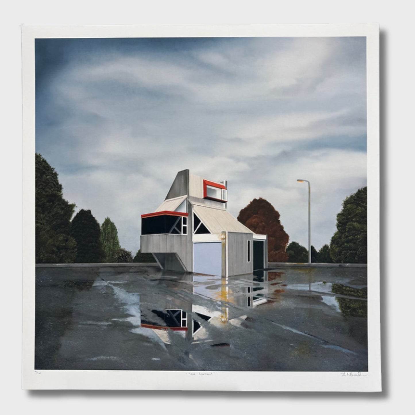 Reflective wet surface with a small abandoned building structure and trees in the background