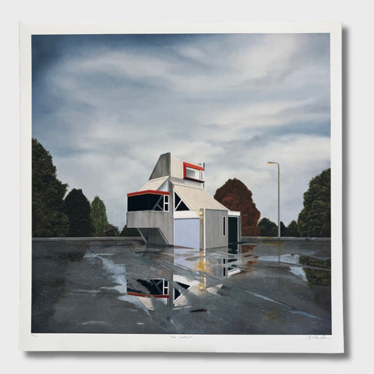 Reflective wet surface with a small abandoned building structure and trees in the background